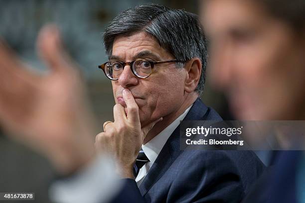 Jacob "Jack" Lew, U.S. Treasury secretary, looks on a John Kerry, U.S. Secretary of state, speaks during a Senate Foreign Relations Committee hearing...