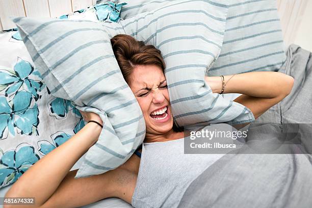 in bed: woman can't sleep - not listening stock pictures, royalty-free photos & images