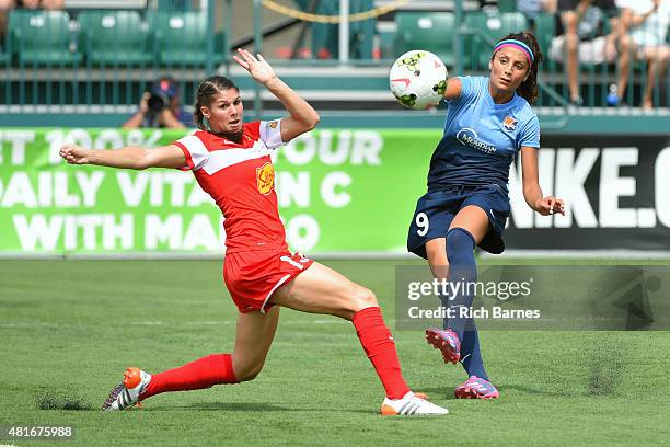 Nadia Nadim of the Sky Blue FC shoots the ball against the defense of Brittany Taylor of the Western New York Flash during the first half at Sahlen's...