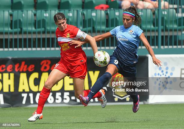 Brittany Taylor of the Western New York Flash and Nadia Nadim of the Sky Blue FC battle for a loose ball during the first half at Sahlen's Stadium on...
