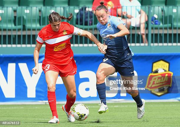 Caitlin Foord of the Sky Blue FC controls the ball against the defense of Brittany Taylor of the Western New York Flash during the first half at...