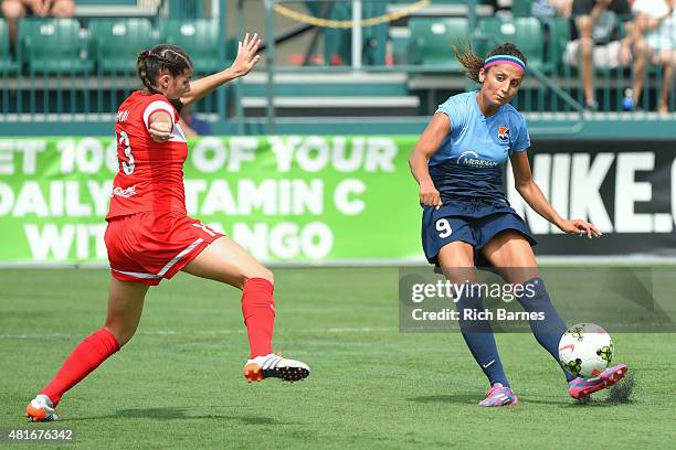 Nadia Nadim of the Sky Blue FC shoots the ball against the defense of Brittany Taylor of the Western New York Flash during the first half at Sahlen's...