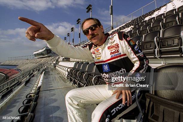 Dale Earnhardt checks out the view from the newly completed Earnhardt Grandstand during winter testing, two weeks before the Daytona 500, at Daytona...