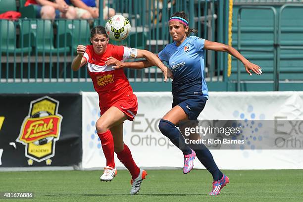 Brittany Taylor of the Western New York Flash and Nadia Nadim of the Sky Blue FC battle for a loose ball during the first half at Sahlen's Stadium on...