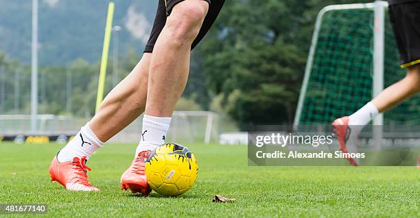 The Puma football boots of of Marco Reus of Borussia Dortmund playing with a small children's ball during a training session ot the training ground...