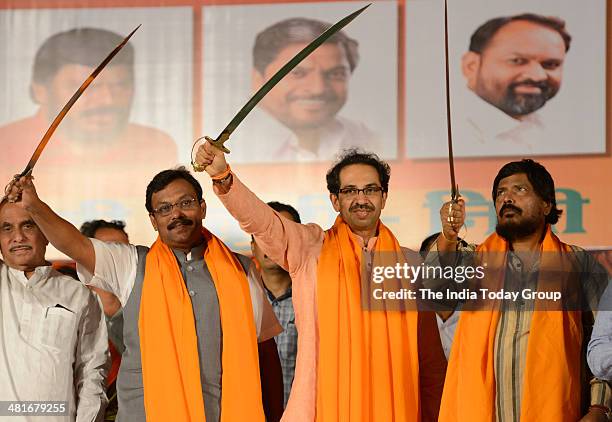 Leader of Opposition in Maharashtra Legislative Council and BJP member Vinod Tavade, Shiv Sena president Uddhav Thackeray and RPI supremo Ramdas...