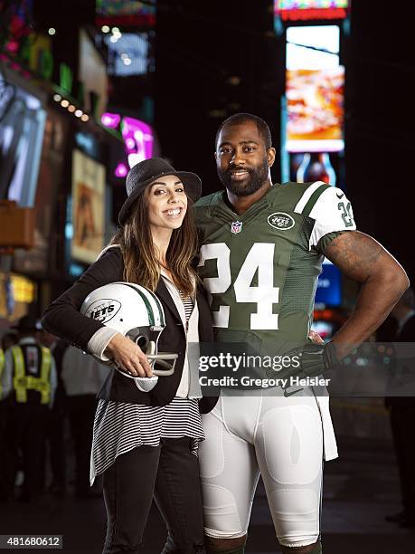 Football player Darrelle Revis is photographed with Jessica Namath for Sports Illustrated on May 6, 2015 in Time Square in New York City. CREDIT MUST...