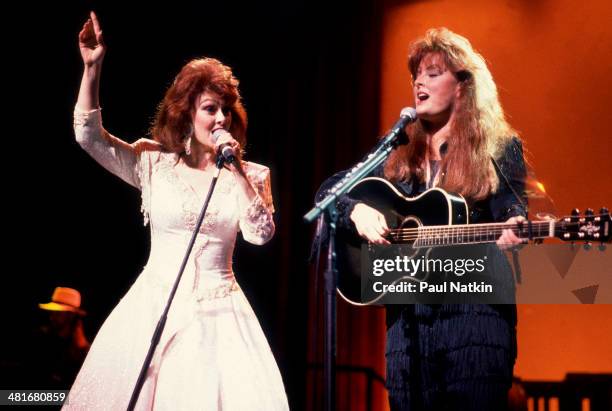 Country music duo the Judds, with Naomi Judd and her daughter Wynonna, perform onstage, Chicago, Illinois, February 1, 1991.