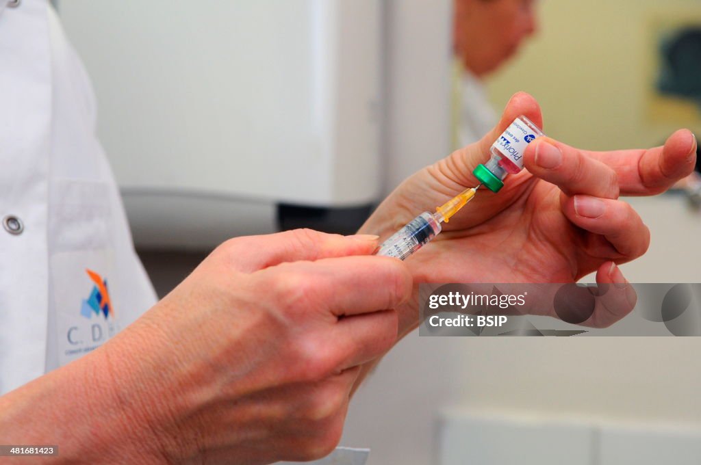 Reportage in the Health and Prevention Centre run by the local committee for social hygiene (CDHS) in Lyon, France. MMR vaccination. Priorix immunises against measles, mumps and rubella.