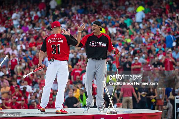 American League All-Star Manny Machado of the Baltimore Orioles hugs National League All-Star Joc Pederson of the Los Angeles Dodgers during the...