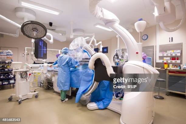 Reportage in the Cardiology Department of Lille hospital, France. Hybrid cardiac surgery operating theatre equipped with the Discovery IGS 730...