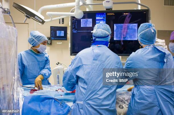 Reportage in the Cardiology Department of Lille hospital, France. Hybrid cardiac surgery operating theatre equipped with the Discovery IGS 730...