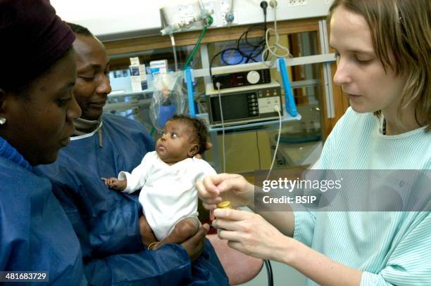 Reportage in the neonatal unit of Robert-Debre hospital in Paris, France. Final advice from the nurse to the parents before leaving the hospital .