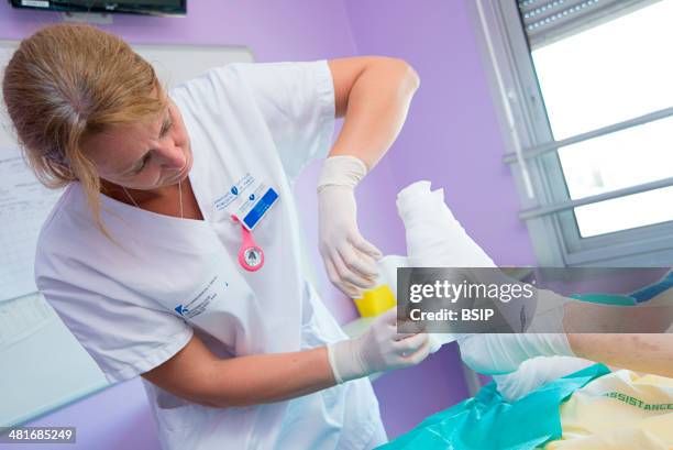 Reportage in the Endocrinology service of Lariboisière hospital in Paris, France. A diabetic's foot dressing.