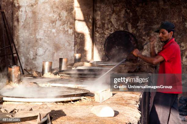 Men preparing food, Charminar, Hyderabad, Andhra Pradesh, India.