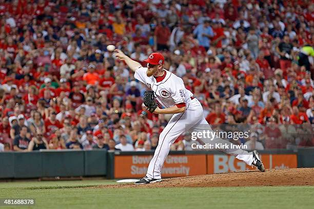 Nate Adcock of the Cincinnati Reds throws a pitch during the game against the Cleveland Indians at Great American Ball Park on July 18, 2015 in...