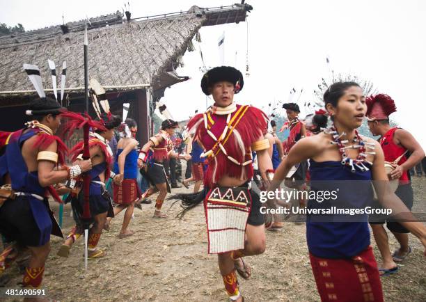 Naga tribal people dancing in traditional costumes, Hornbill Festival, Kohima, Nagaland, India.