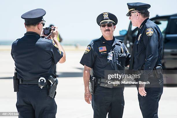 Laredo Police Officers take a picture together before the arrival of Republican Presidential candidate and business mogul Donald Trump during his...