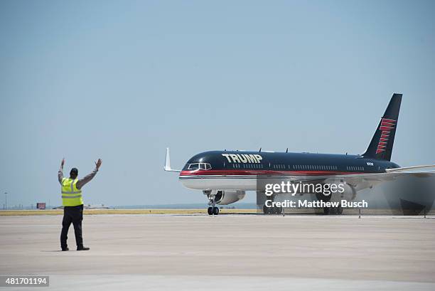 Republican Presidential candidate and business mogul Donald Trump arrives on his plane during his campaign trip to the border on July 23, 2015 in...