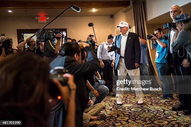 Republican Presidential candidate and business mogul Donald Trump talks to the media before a press conference during his trip to the border on July...