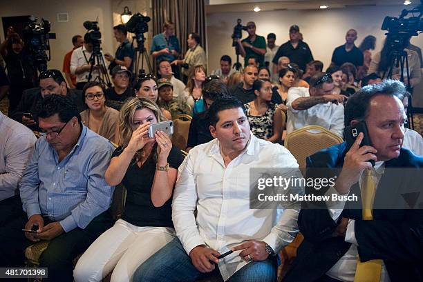 An audience waits for the arrival of Republican Presidential candidate and business mogul Donald Trump at a press conference during his trip to the...