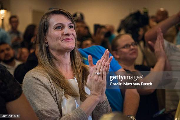 Chandra Claassen listens to Republican Presidential candidate and business mogul Donald Trump at a press conference during his trip to the border on...