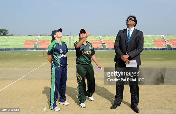 Isobel Joyce captain of Ireland , Sana Mir captain of Pakistan and ICC match referee Javagal Srinath during the toss before the start of the ICC...