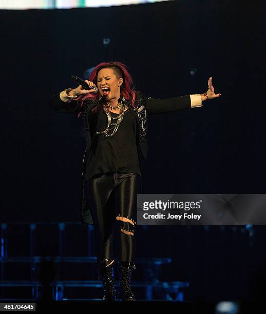 Demi Lovato performs in concert on the Neon Lights Tour at Bankers Life Fieldhouse on March 30, 2014 in Indianapolis, Indiana.
