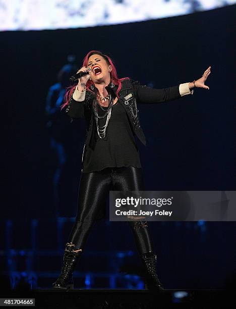 Demi Lovato performs in concert on the Neon Lights Tour at Bankers Life Fieldhouse on March 30, 2014 in Indianapolis, Indiana.