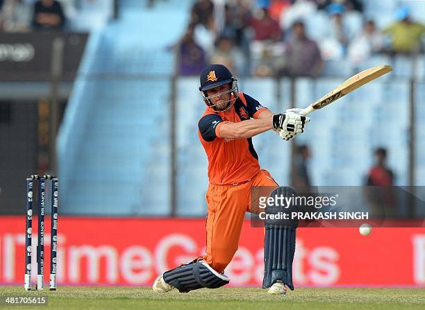 Netherlands batsman Tom Cooper plays a shot during the ICC World Twenty20 tournament cricket match between Netherlands and England at The Zahur Ahmed...