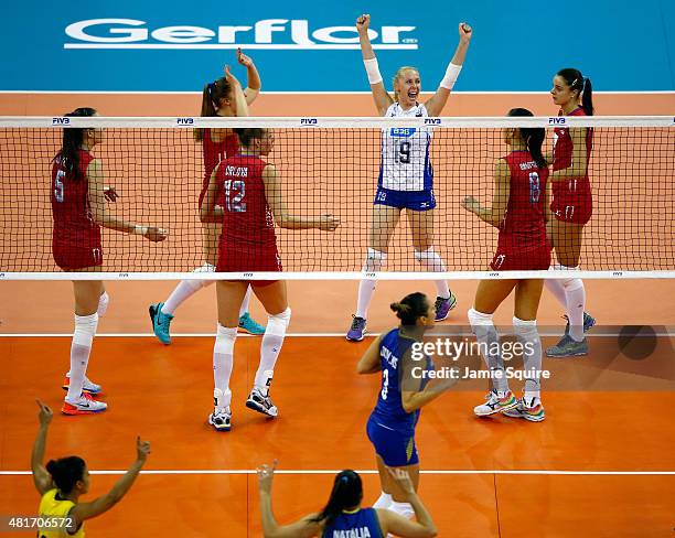 Anna Malova of Russia celebrates with teammates after a point during the final round match against Brazil on day 2 of the FIVB Volleyball World Grand...