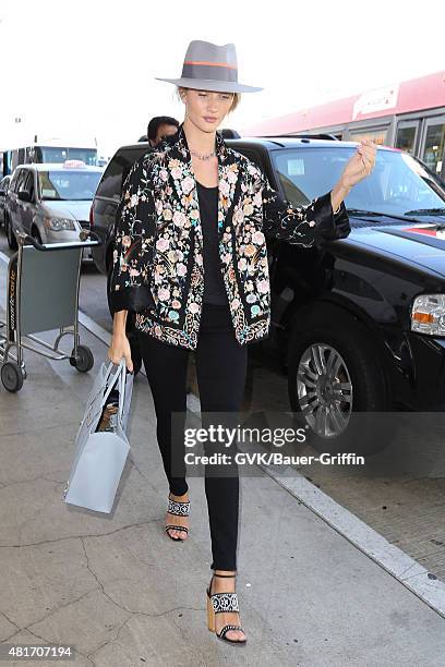 Rosie Huntington-Whiteley is seen at LAX on July 23, 2015 in Los Angeles, California.