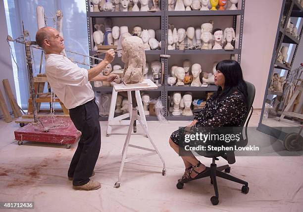 Sculptor Michael Evert creates a sculpture of designer Anna Sui as part of the Ralph Pucci: The Art of the Mannequin exhibit at Museum of Arts and...