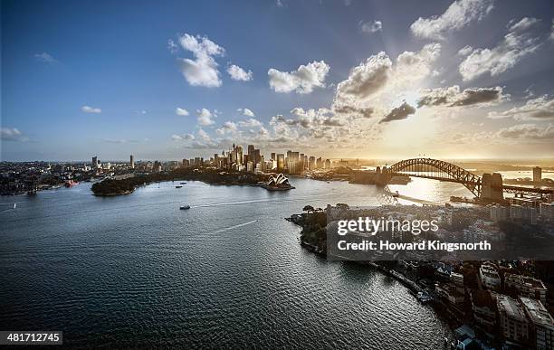 aeriall view of sydney harbour at sunset - hafenbrücke von sydney stock-fotos und bilder