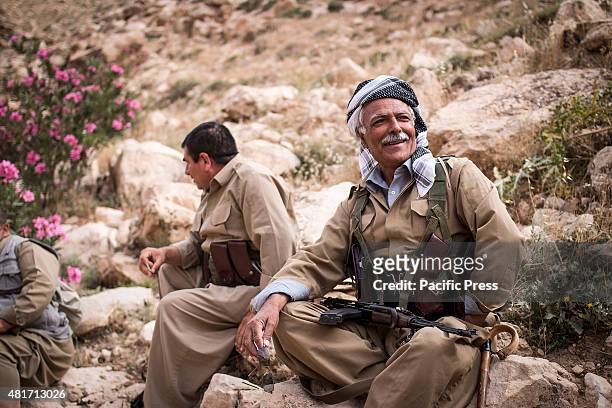 Peshmerga smiles during a rest. Peshmergas were trained on the mountains for survival and endurance, to prepare themselves for war.