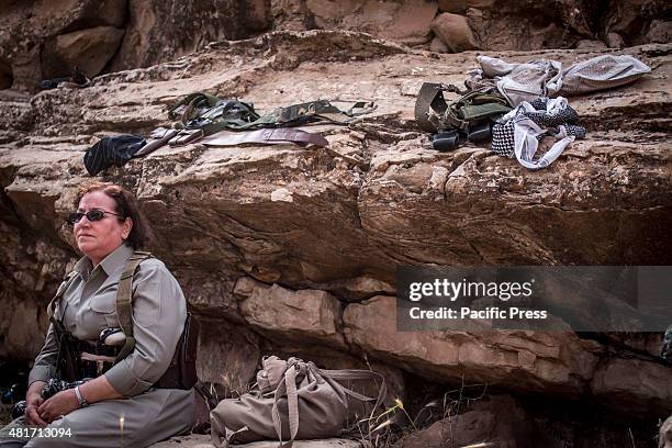 Female Pershmerga rests after her training. Peshmergas were trained on the mountains for survival and endurance, to prepare themselves for war.