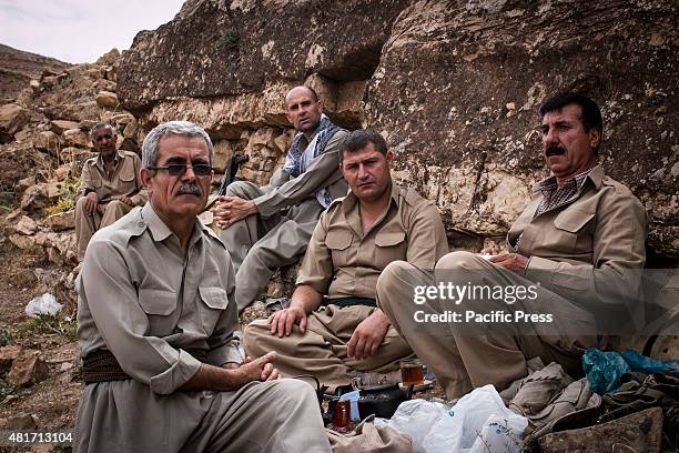 The Peshmergas take rests after their training. Peshmergas were trained on the mountains for survival and endurance, to prepare themselves for war.