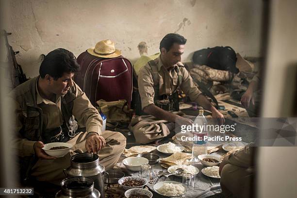 The Peshmergas eat a meal after the test day. Peshmergas were trained on the mountains for survival and endurance, to prepare themselves for war.
