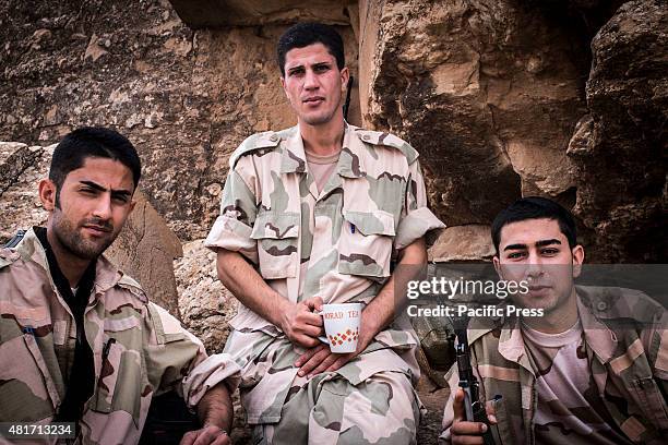 The newly recruited peshmergas pose after their test day. Peshmergas were trained on the mountains for survival and endurance, to prepare themselves...