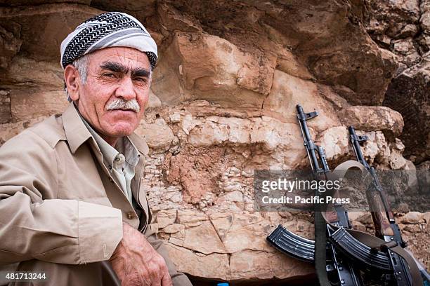 An Old Peshmerga holds his weapon. Peshmergas were trained on the mountains for survival and endurance, to prepare themselves for war.