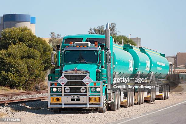 “without trucks, australia stops", toll fuel road train - tractor filling up with fuel stockfoto's en -beelden