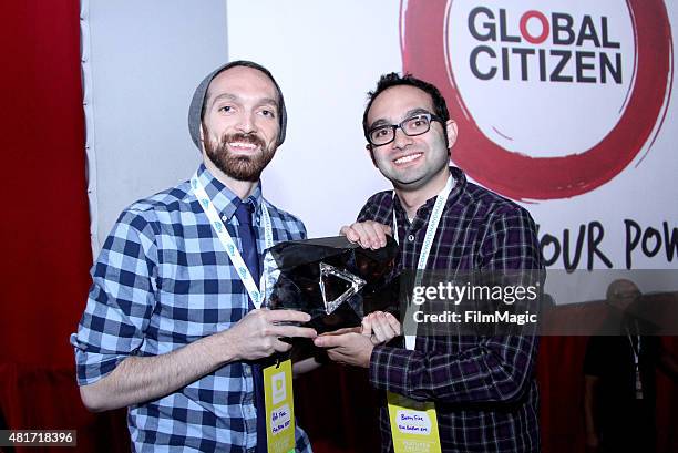 The Fine Bros pose with the Diamond Award for achieving over 10 million subscribers on YouTube at #VidCon at Anaheim Convention Center on July 23,...