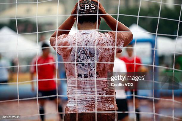 Player in action during a game of 2015 Swamp Soccer China at Yuetan gymnasium on July 23, 2015 in Beijing, China. Thirty-two teams take part in 2015...