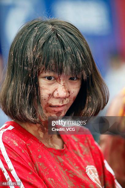 Woman in action during a game of 2015 Swamp Soccer China at Yuetan gymnasium on July 23, 2015 in Beijing, China. Thirty-two teams take part in 2015...