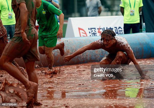 Player in action during a game of 2015 Swamp Soccer China at Yuetan gymnasium on July 23, 2015 in Beijing, China. Thirty-two teams take part in 2015...