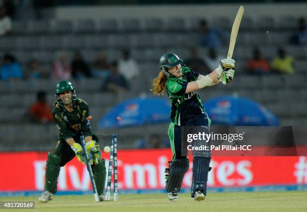 Melissa Scott Hayward of Ireland gets bowled out by Anam Amin of Pakistan during the ICC Women's World Twenty20 match between Pakistan Women and...