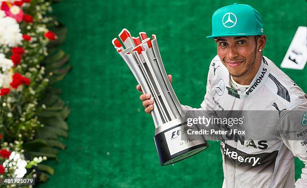 Lewis Hamilton of Great Britain and Mercedes wins the Malaysian F1 Grand Prix at Sepang Circuit on March 30, 2014 in Kuala Lumpur, Malaysia.