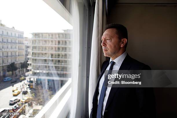 Yannis Stournaras, Greece's finance minister, poses for a photograph following a Bloomberg Television interview at the Ministry of Finance offices in...