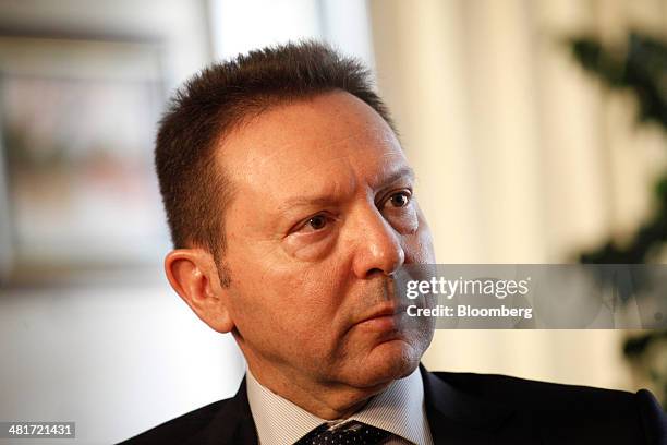 Yannis Stournaras, Greece's finance minister, pauses during a Bloomberg Television interview at the Ministry of Finance offices in Athens, Greece, on...