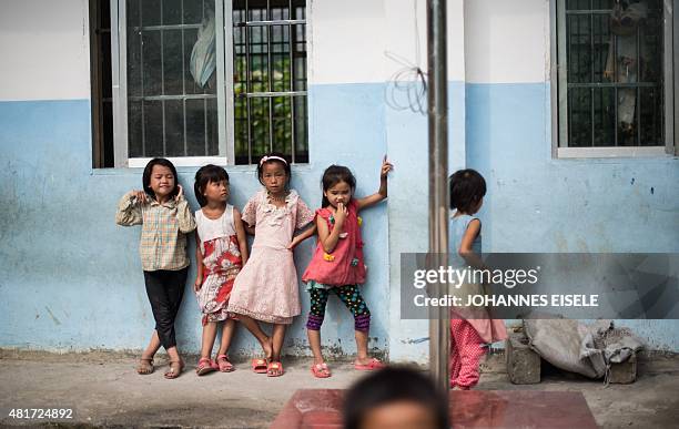 China-education-children-economy,FOCUS by Johannes Eisele This photo taken on June 19, 2015 shows children playing in the school yard of the...